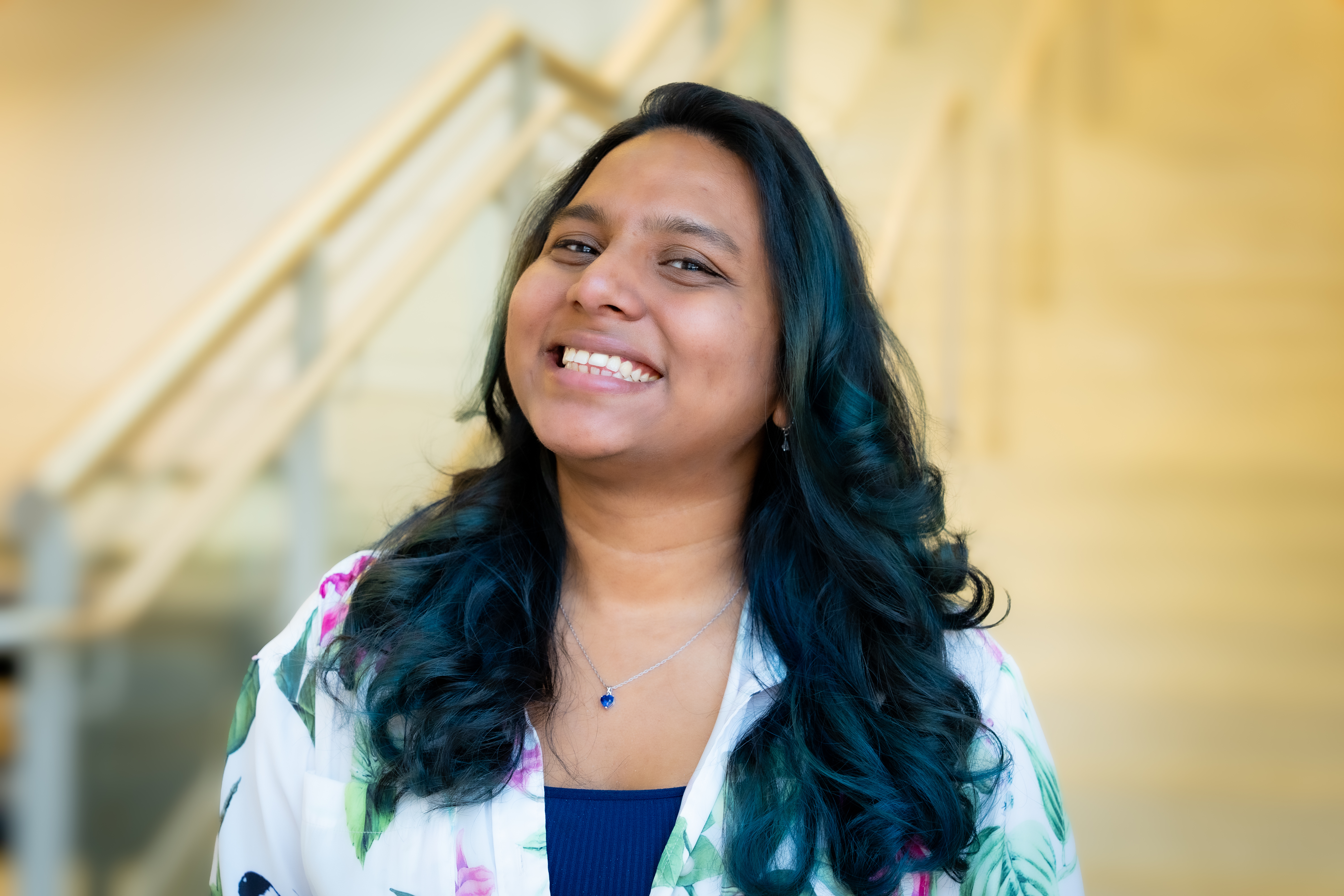 A professional headshot of Ronita in the IMET Lobby