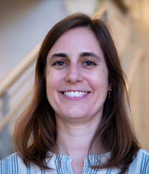 A professional headshot of Allison Tracy in the IMET lobby