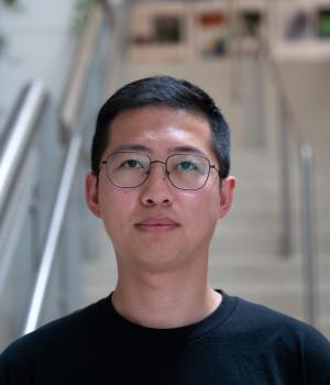 A professional headshot of Yuting Lin in the IMET lobby 