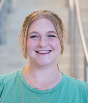 A professional headshot of Briley in the IMET Lobby