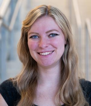 A professional headshot of Caroline in the IMET Lobby