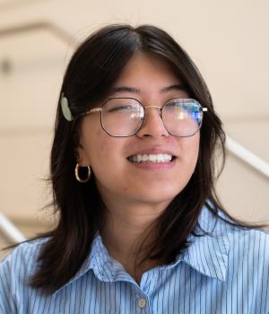 A professional headshot of Jenny in the IMET Lobby