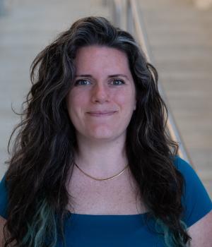 A professional headshot of Kristina in the IMET lobby