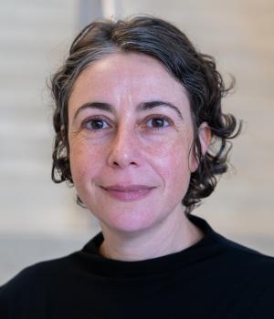 A professional headshot of Nathalie in the IMET lobby
