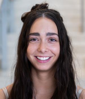A professional headshot of Joanne in the IMET lobby