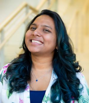 A professional headshot of Ronita in the IMET lobby