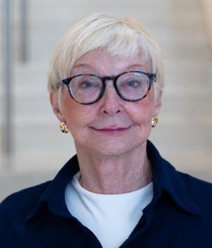 A professional headshot of Rose in the IMET lobby