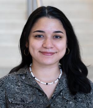A professional headshot of Veronica in the IMET lobby
