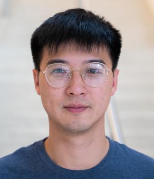 A professional headshot of Yu Ting in the IMET lobby