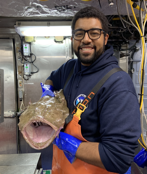 Image of Ben Frey holding a monkfish on a boat