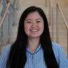 A professional headshot of Ally in the IMET lobby