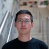 A professional headshot of Yuting Lin in the IMET lobby 