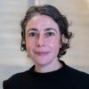 A professional headshot of Nathalie in the IMET lobby