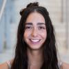 A professional headshot of Joanne in the IMET lobby