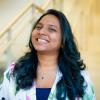A professional headshot of Ronita in the IMET lobby