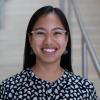 A professional headshot of Tessa in the IMET lobby