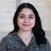 A professional headshot of Veronica in the IMET lobby