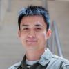A professional headshot of Yalong in the IMET lobby