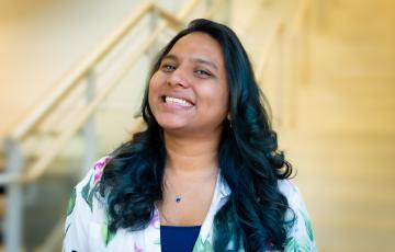 A professional headshot of Ronita in the IMET Lobby