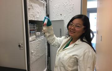 Kehau Hagiwara holding a cell pellet of Rhodothermus marinus, a red-pigmented strain of thermophilic bacteria