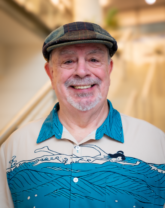 A professional headshot of Al Place in the IMET lobby